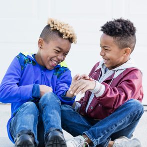 Little boys, brothers and best friends, laughing