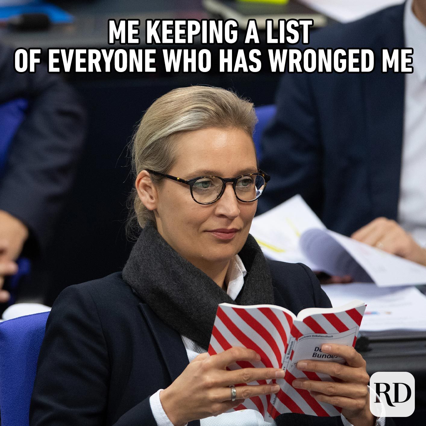 Woman looking skeptically at paper. Meme text: Me keeping a list of everyone who has wronged me