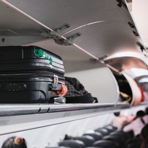 Overhead Locker On Airplane,passenger Put Cabin Bag Cabin On The Top Shelf