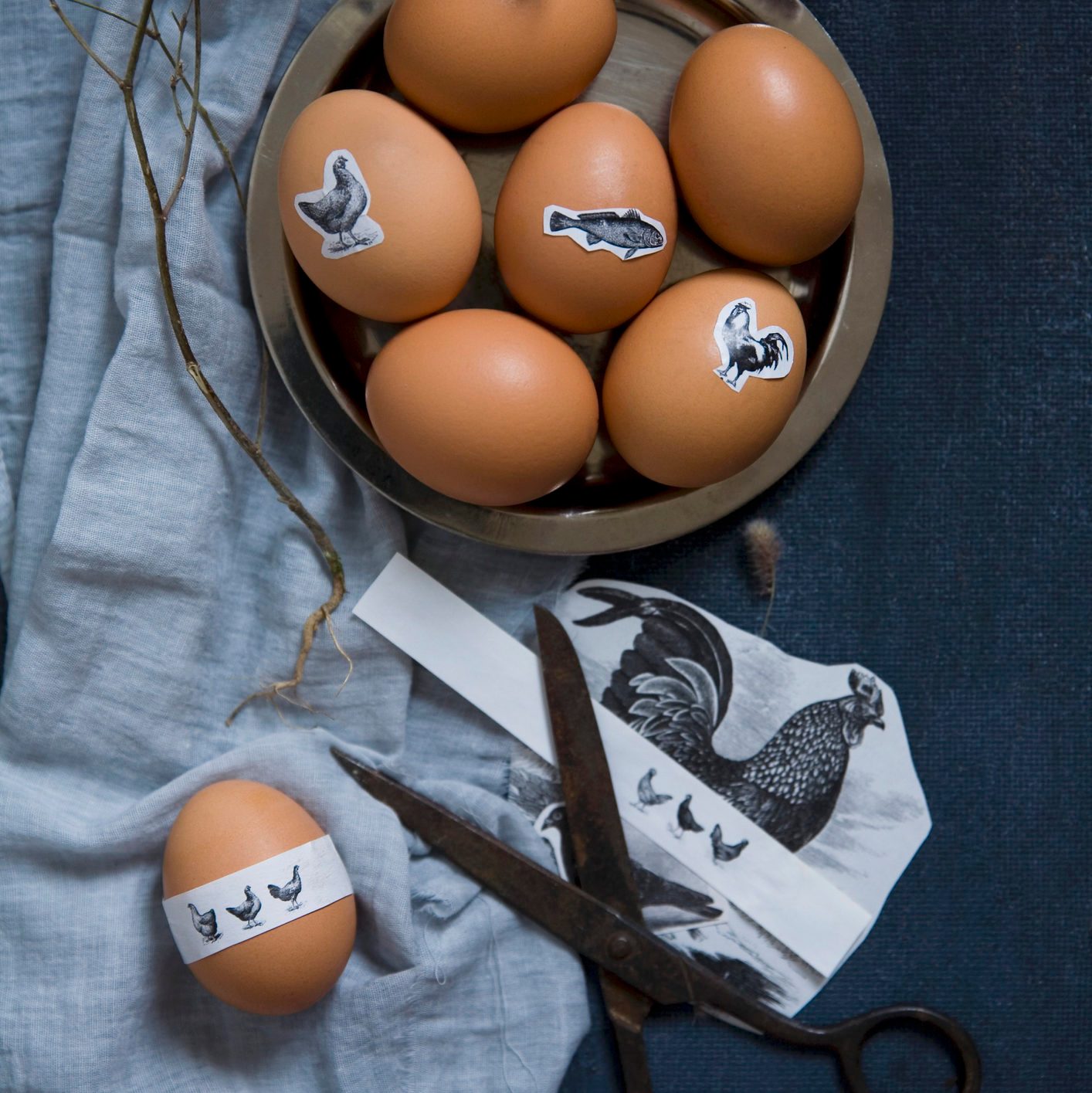 Easter eggs with animal motif stickers in a bowl