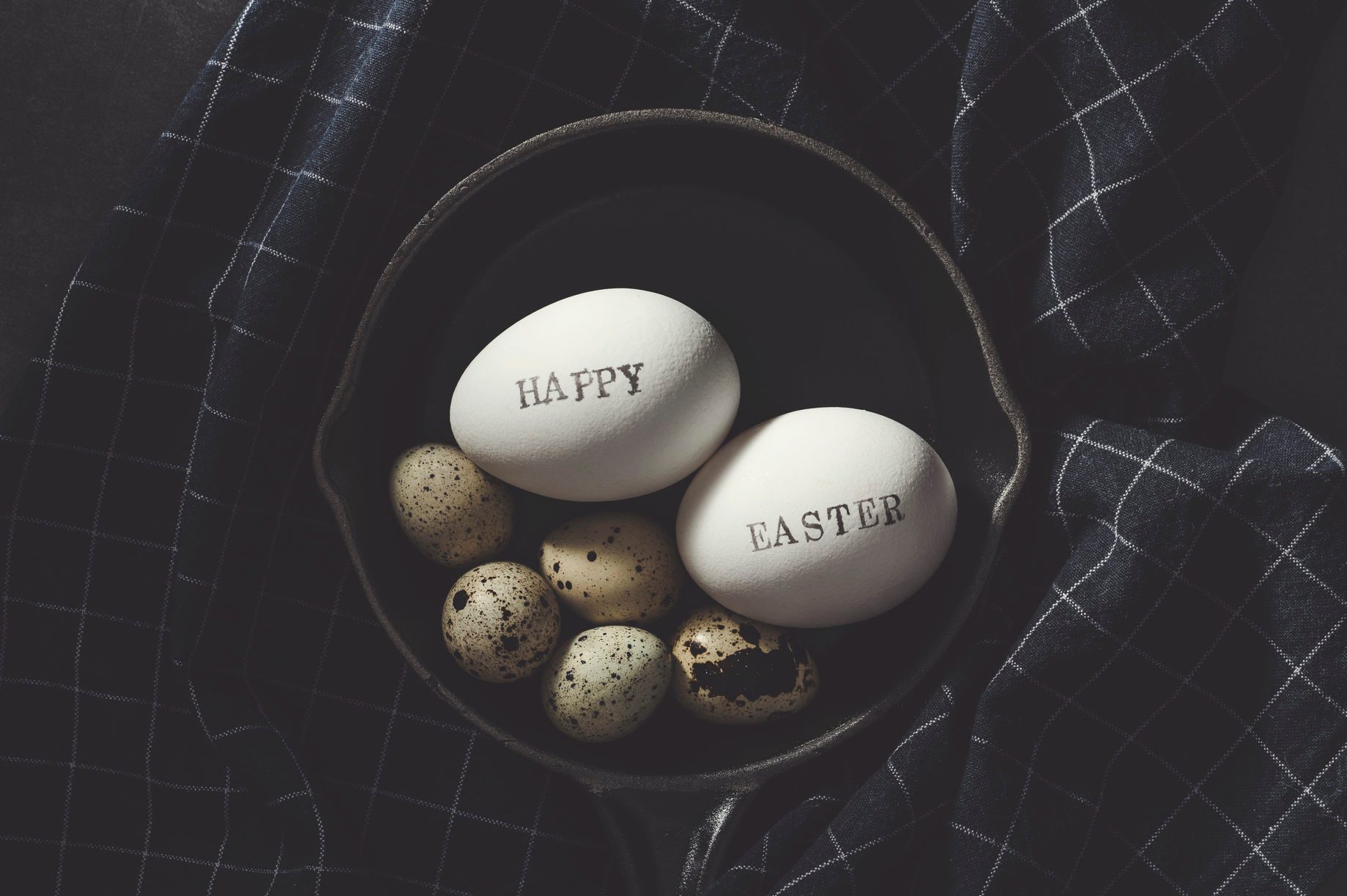 eggs with Happy Easter stamped white eggs in stoneware pan