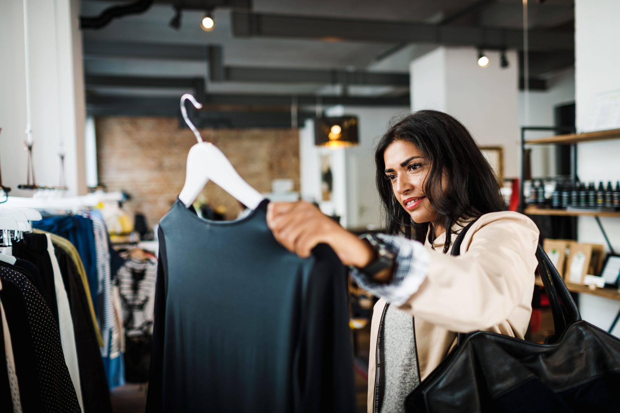 Woman Looking At Blouse While Out Shopping