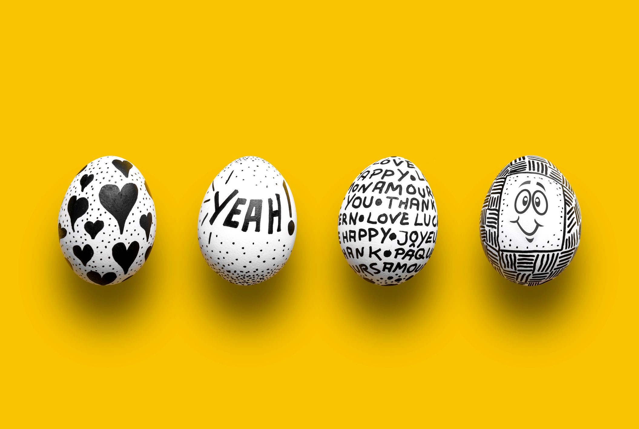 Painted Easter eggs on yellow background