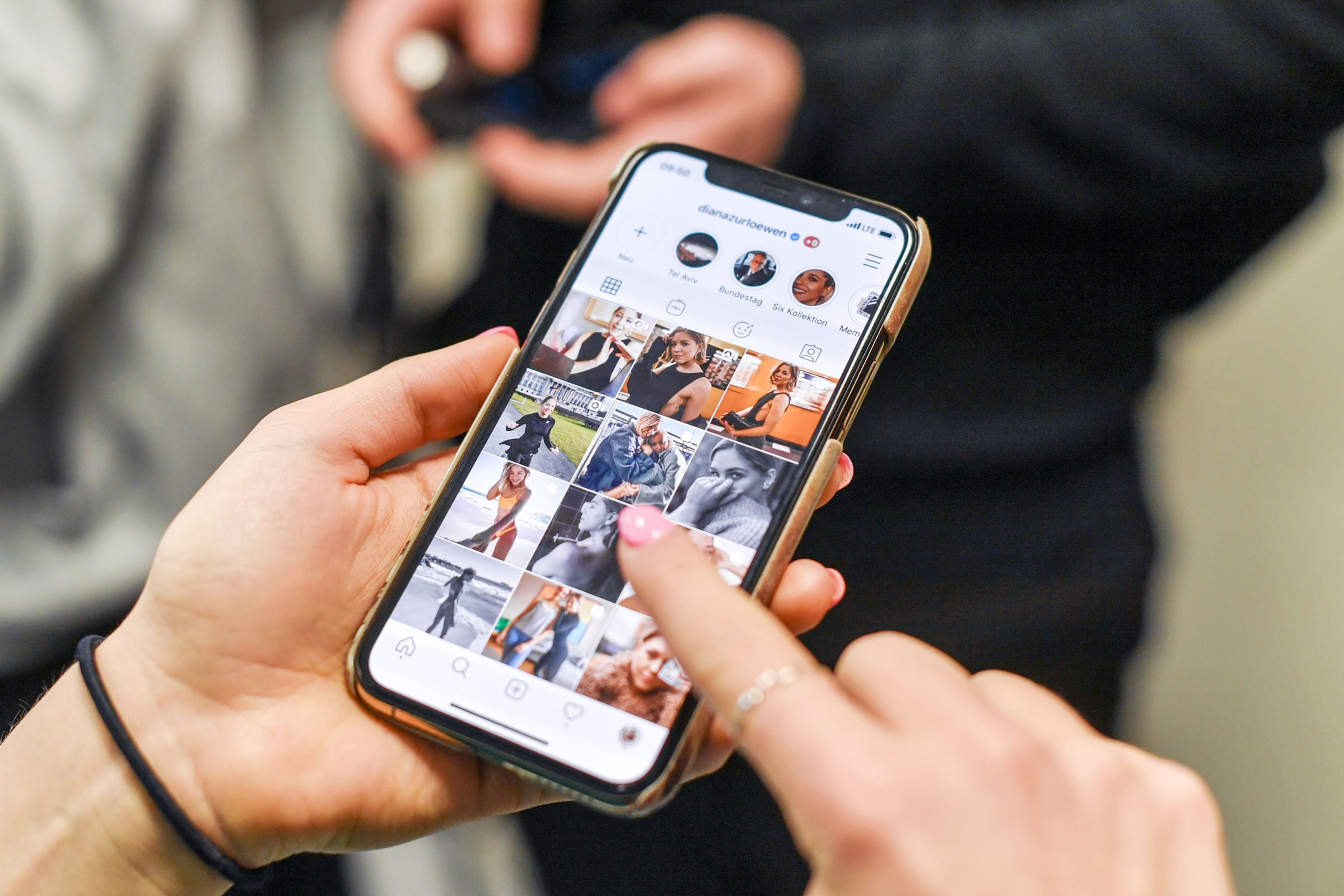 woman looking at instagram on a phone