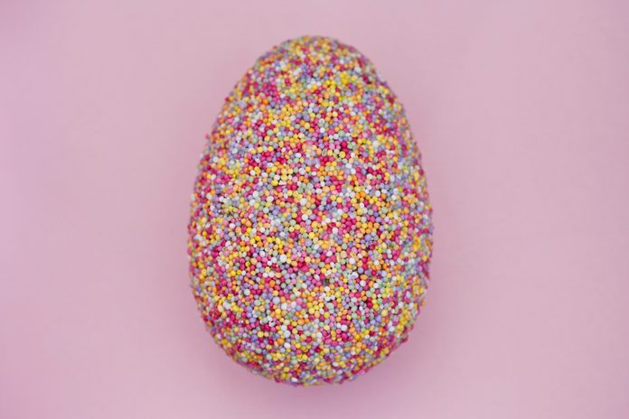 Easter egg covered in candy sprinkles