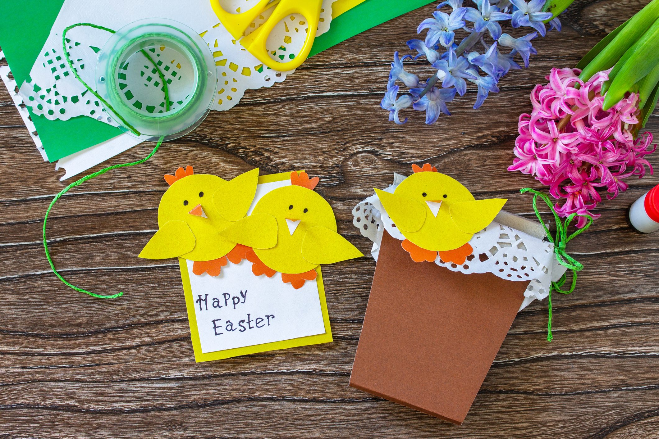 Child gift postcard happy easter chickens toy on a wooden table. Handmade. Project of childrens creativity, handicrafts, crafts for kids.