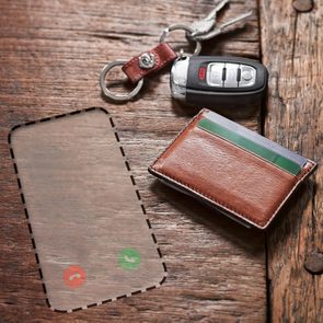 keys, wallet, and a space for a missing phone that may have been stolen or lost