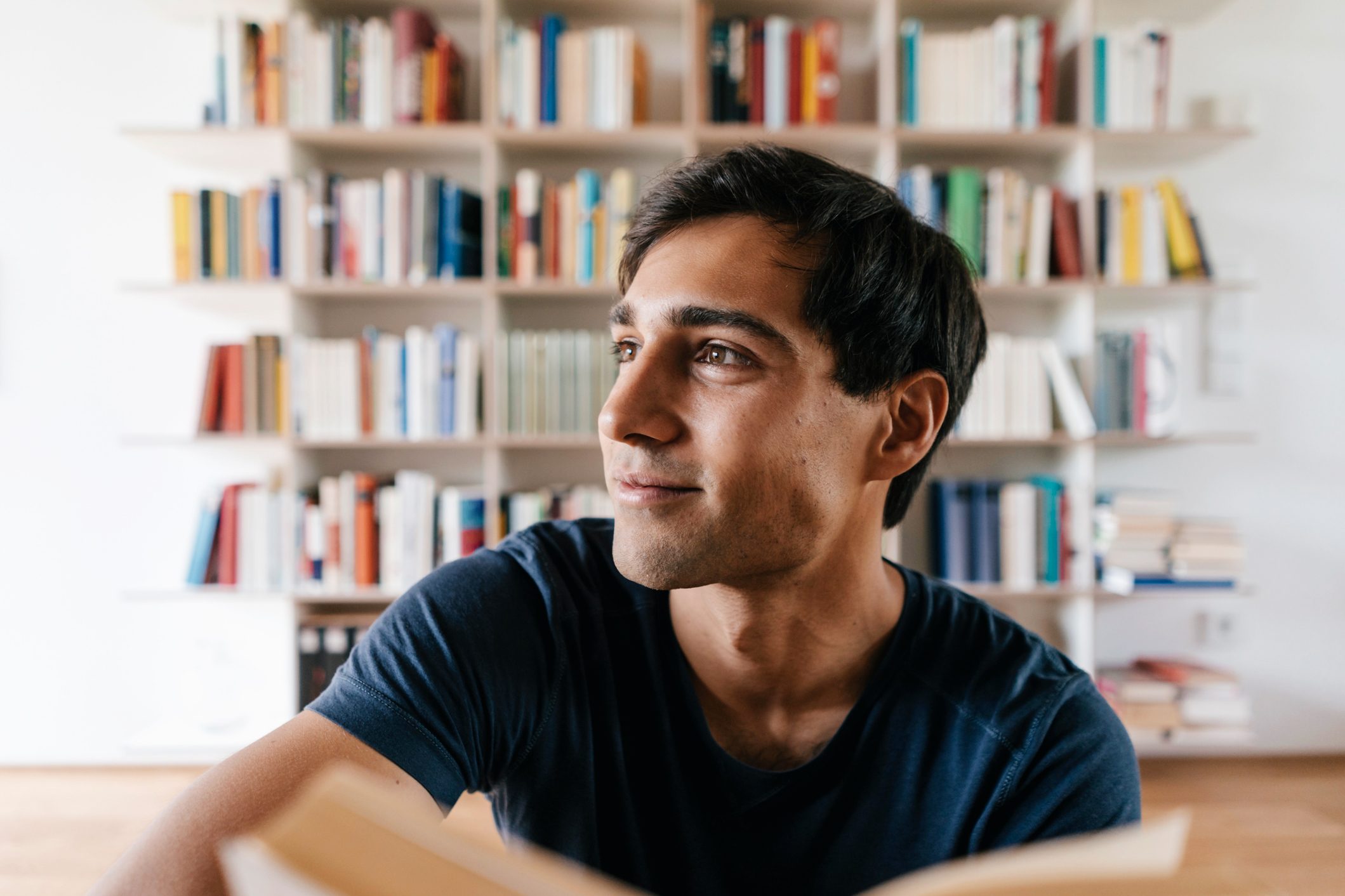 man reading and thinking
