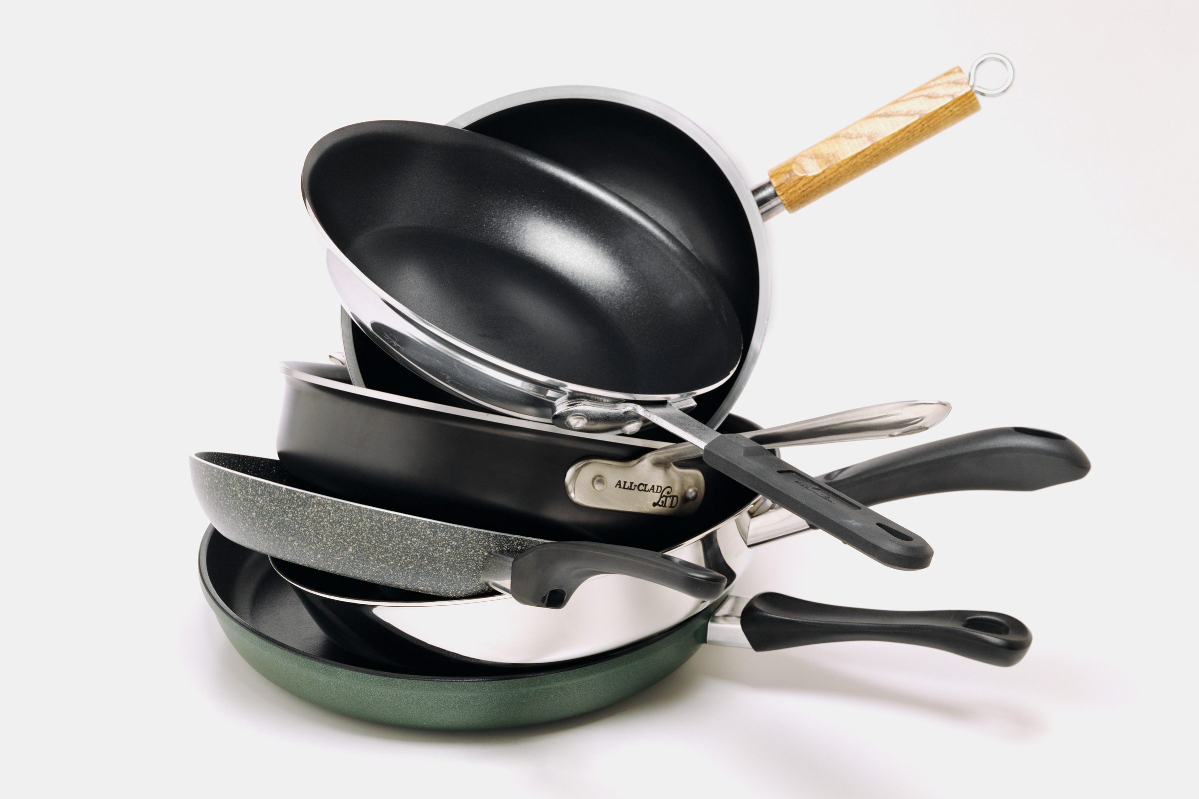 stack of Pots And Pans on a gray background