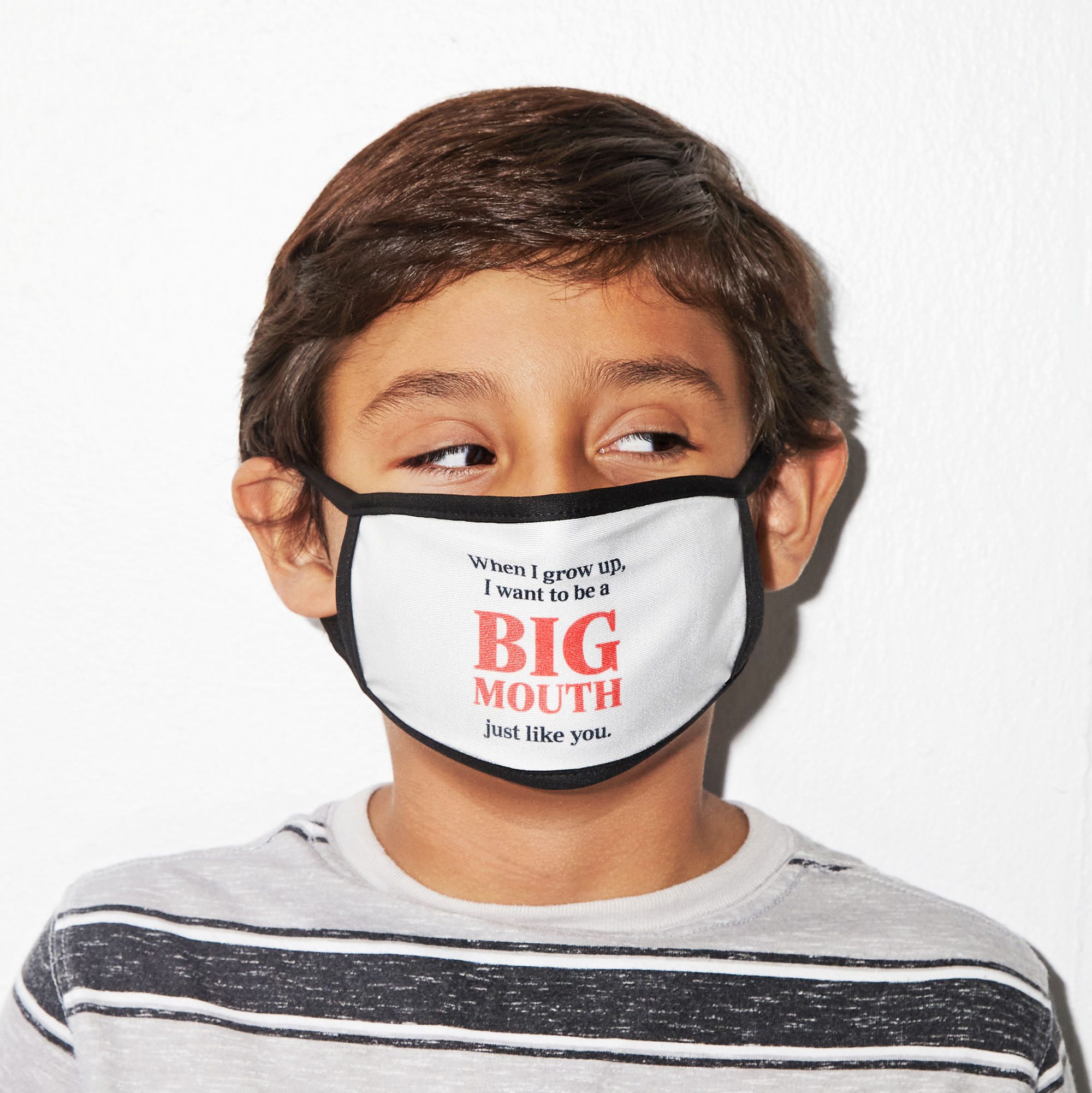 boy wearing a face mask that reads, "When I grow up, I want to be a BIG MOUTH just like you."