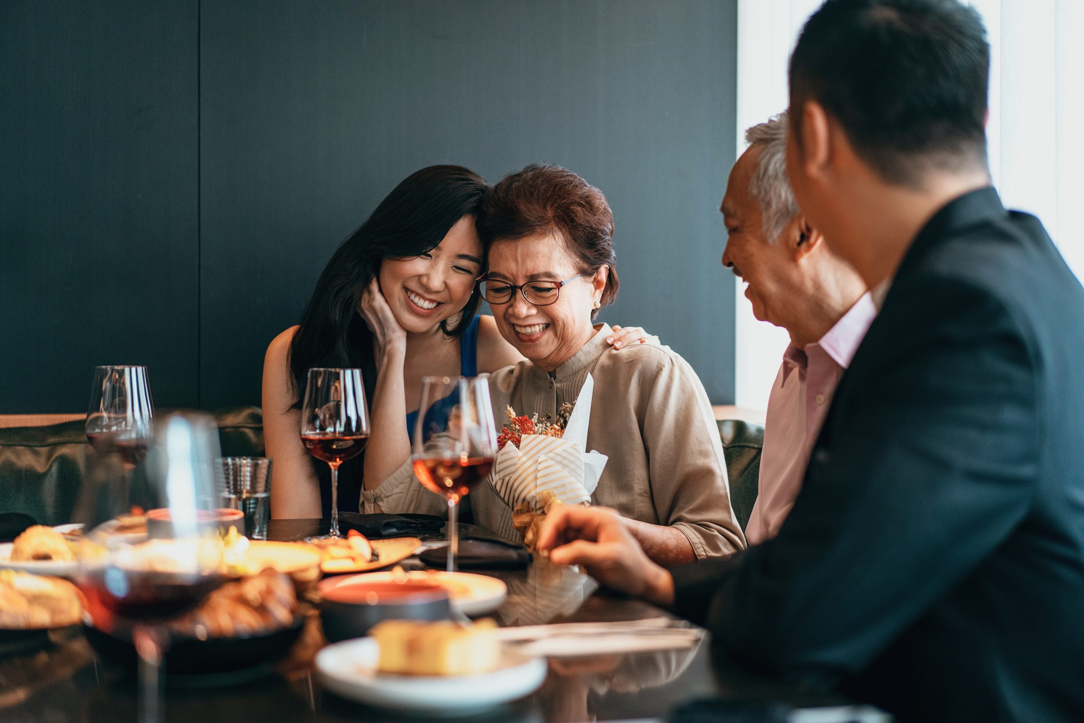 Asian family dining and celebrating Mother's day or birthday