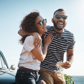 couple laughing about an april fools joke