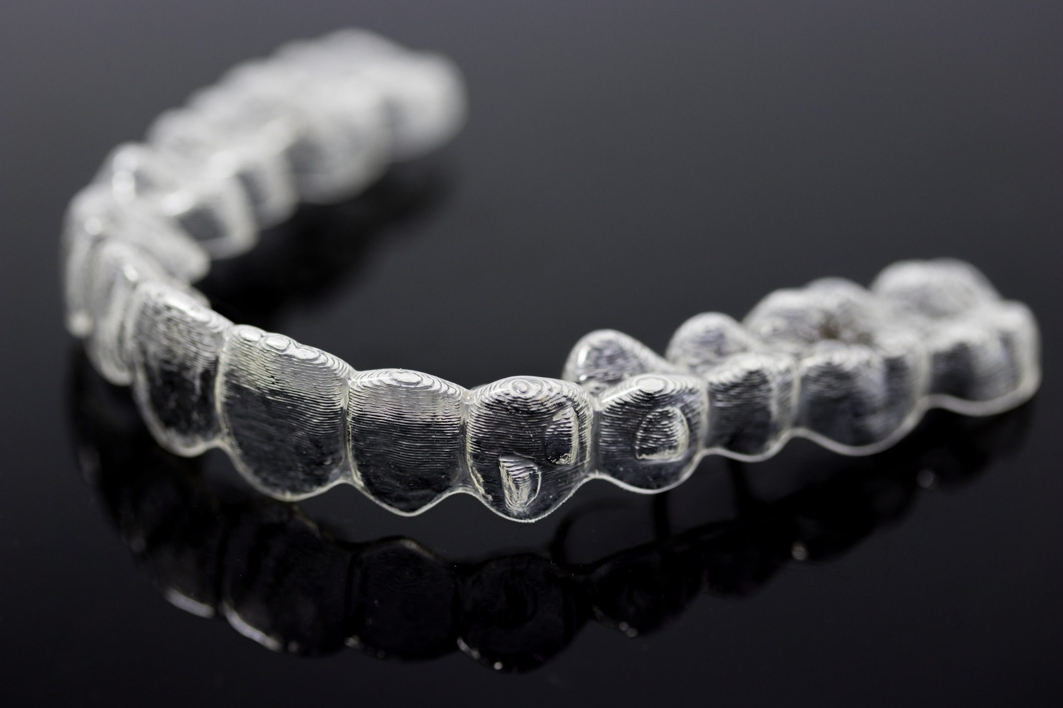 Invisalign braces close up on black