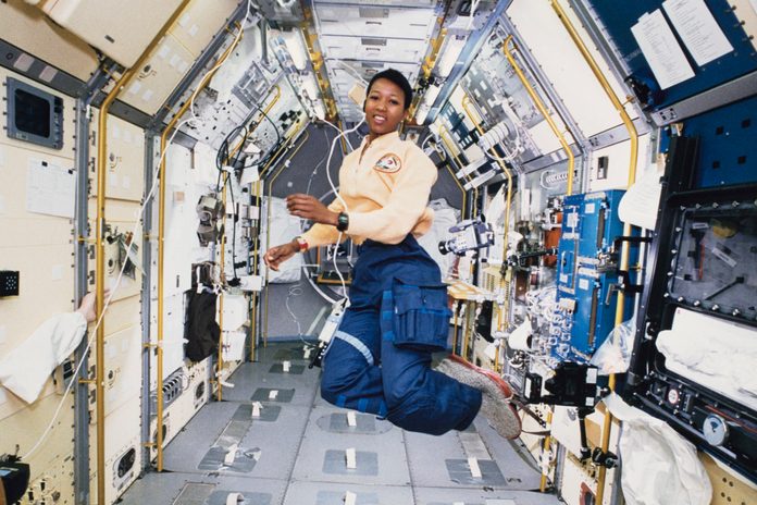 Mae Jemison works in zero gravity in the centre aisle of the Spacelab Japan (SLJ) science module aboard OV-105, the Space Shuttle Endeavour, during NASA's STS-47 mission, 20th September 1992.