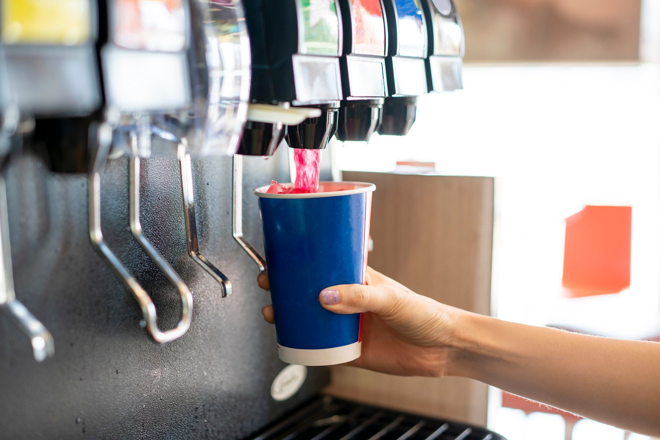 Man pours a fizzy drink.sparkling water.cool ice soft drink cola