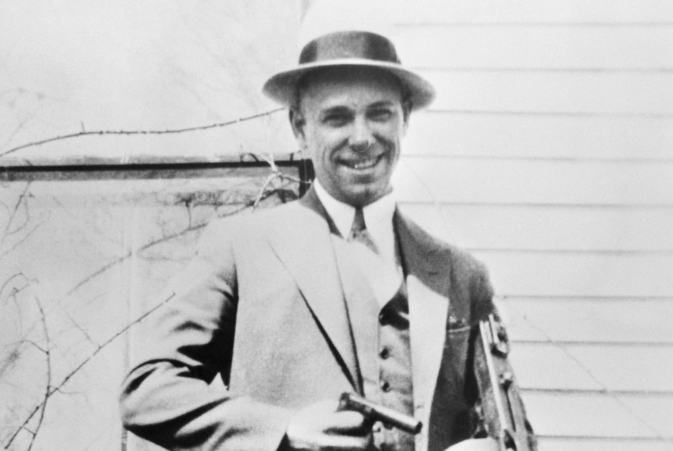 John Dillinger Poses with Machine Gun