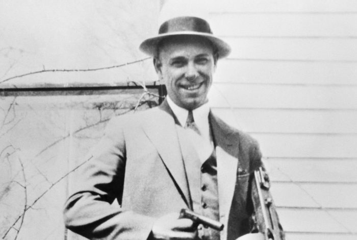 John Dillinger Poses with Machine Gun