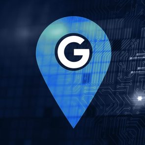 google logo in a location marker with a dark blue circuit illustration as the background