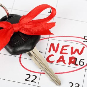 car key with ribbon on calendar background