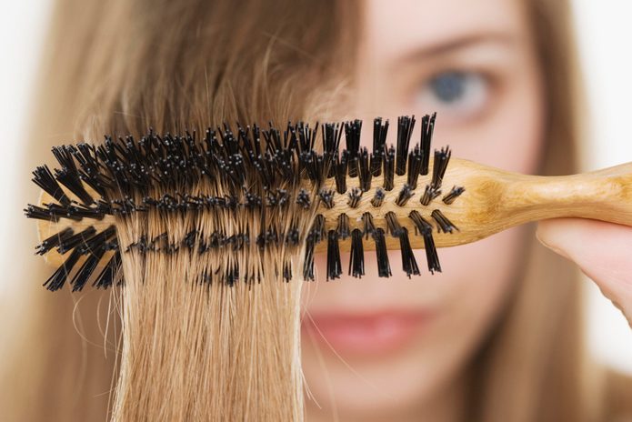 Close up of hairbrush in woman?s hair