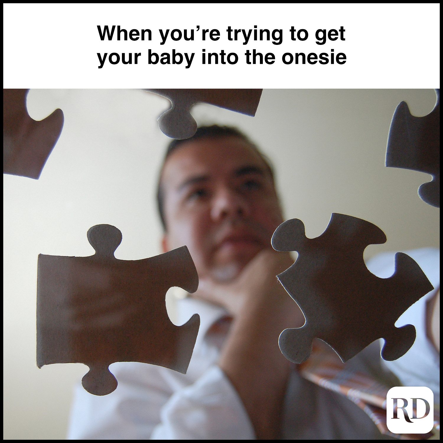 When you’re trying to get your baby. Into the onesie