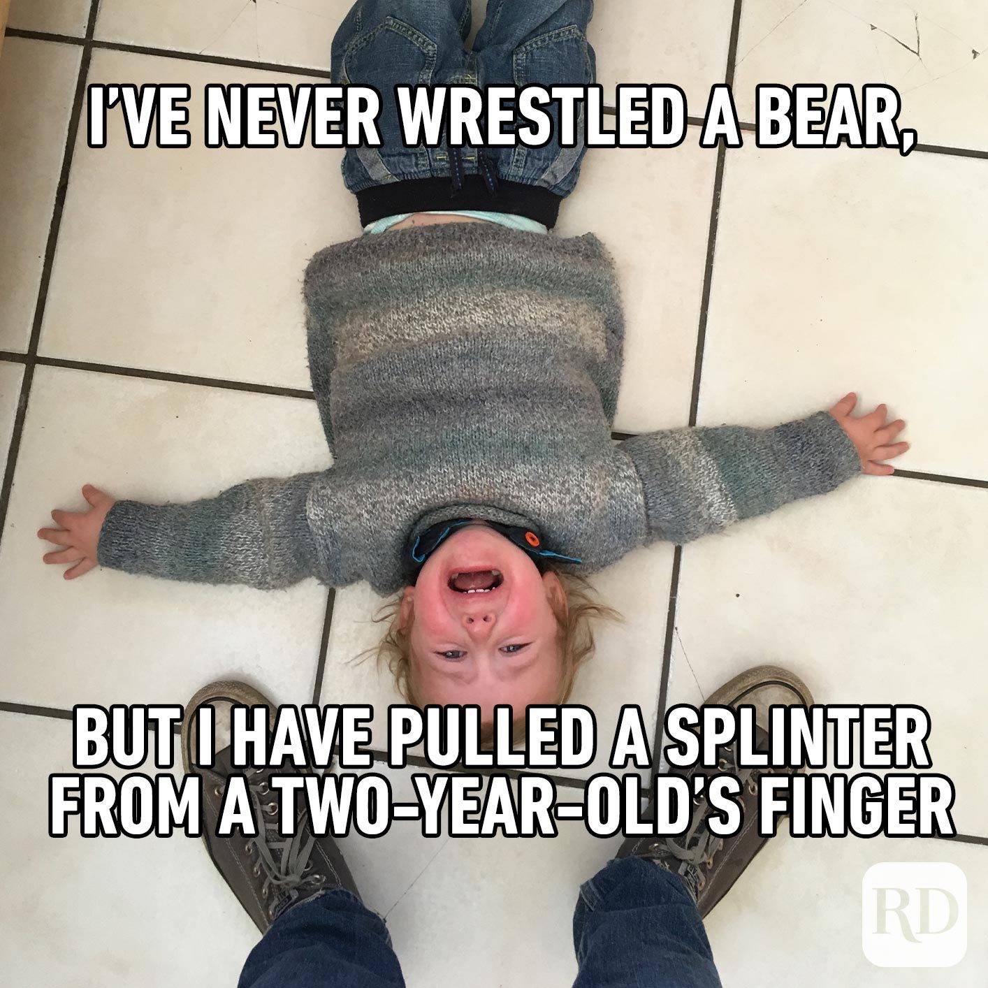 Child throwing tantrum on the floor. MEME TEXT: I've never wrestled a bear, but I have pulled a splinter from a two-year-old's finger