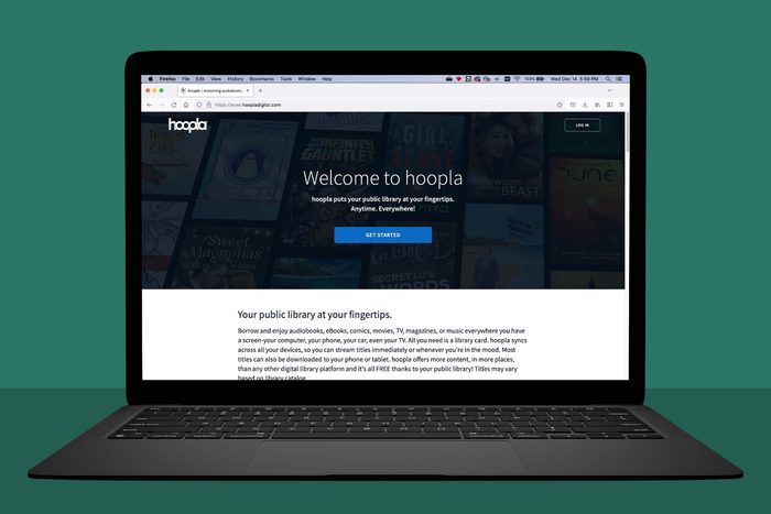 laptop showing hoopladigital.com; green background