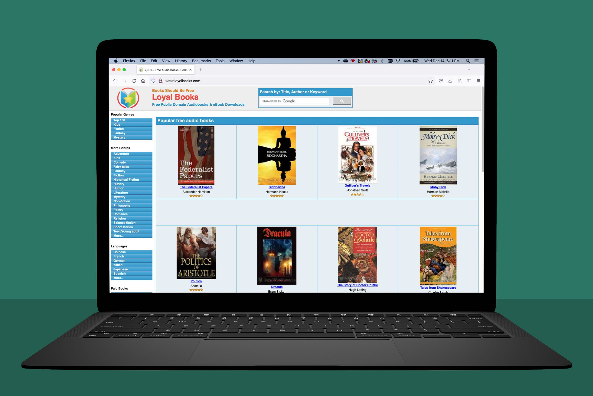 laptop showing loyalbooks.com; green background