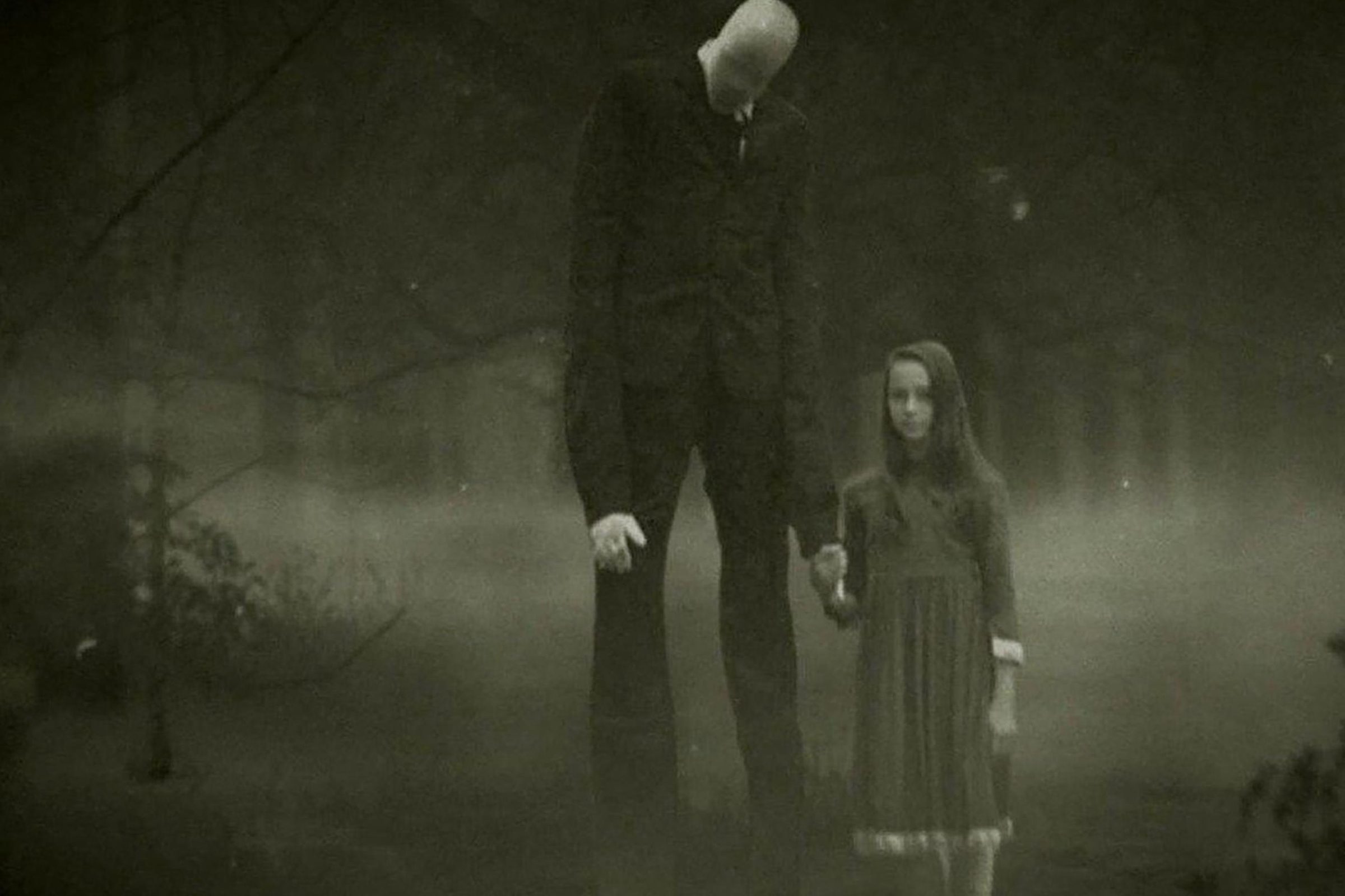 Little girl holding the hand of the slenderman