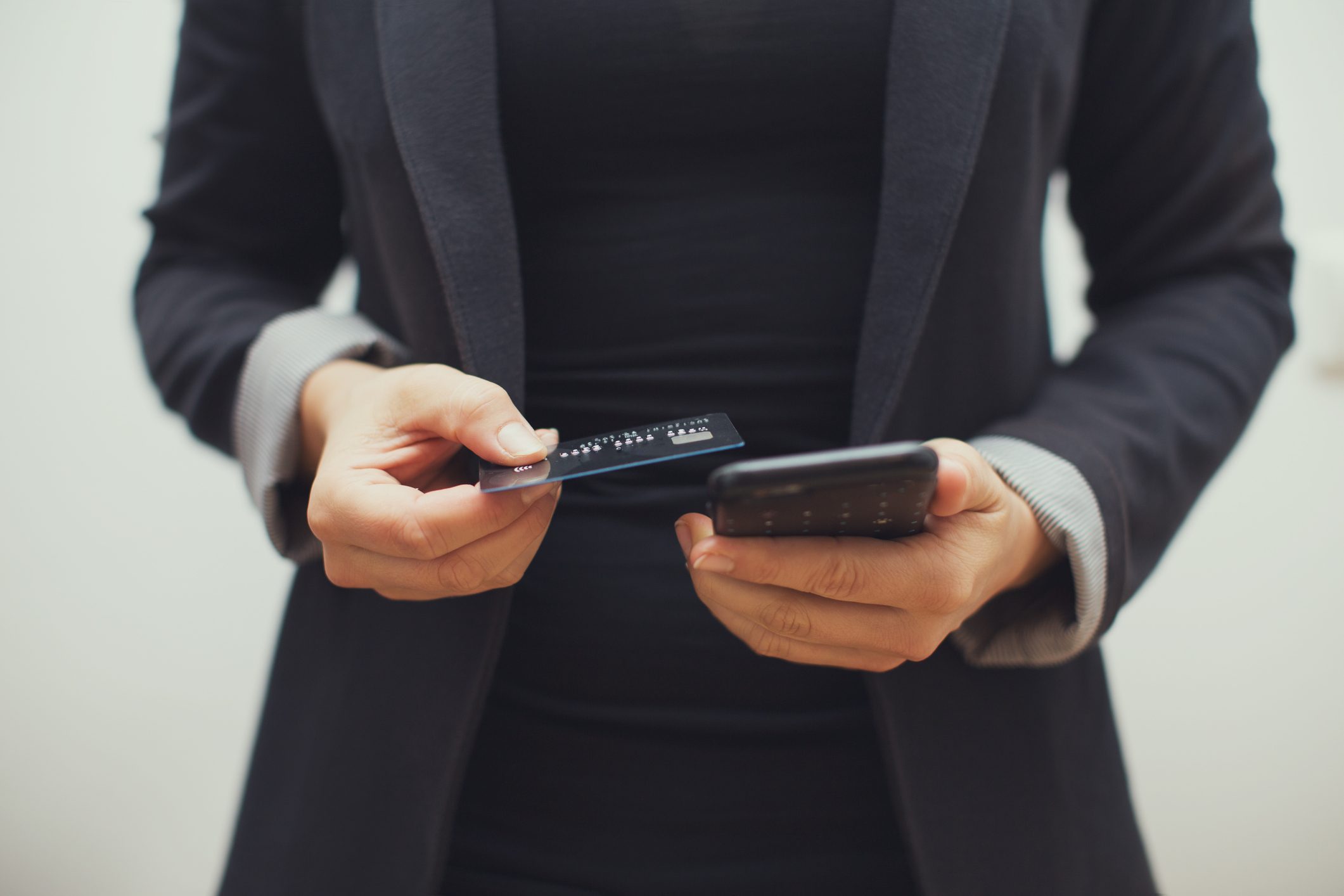 Woman wearing Blazer ordering something online