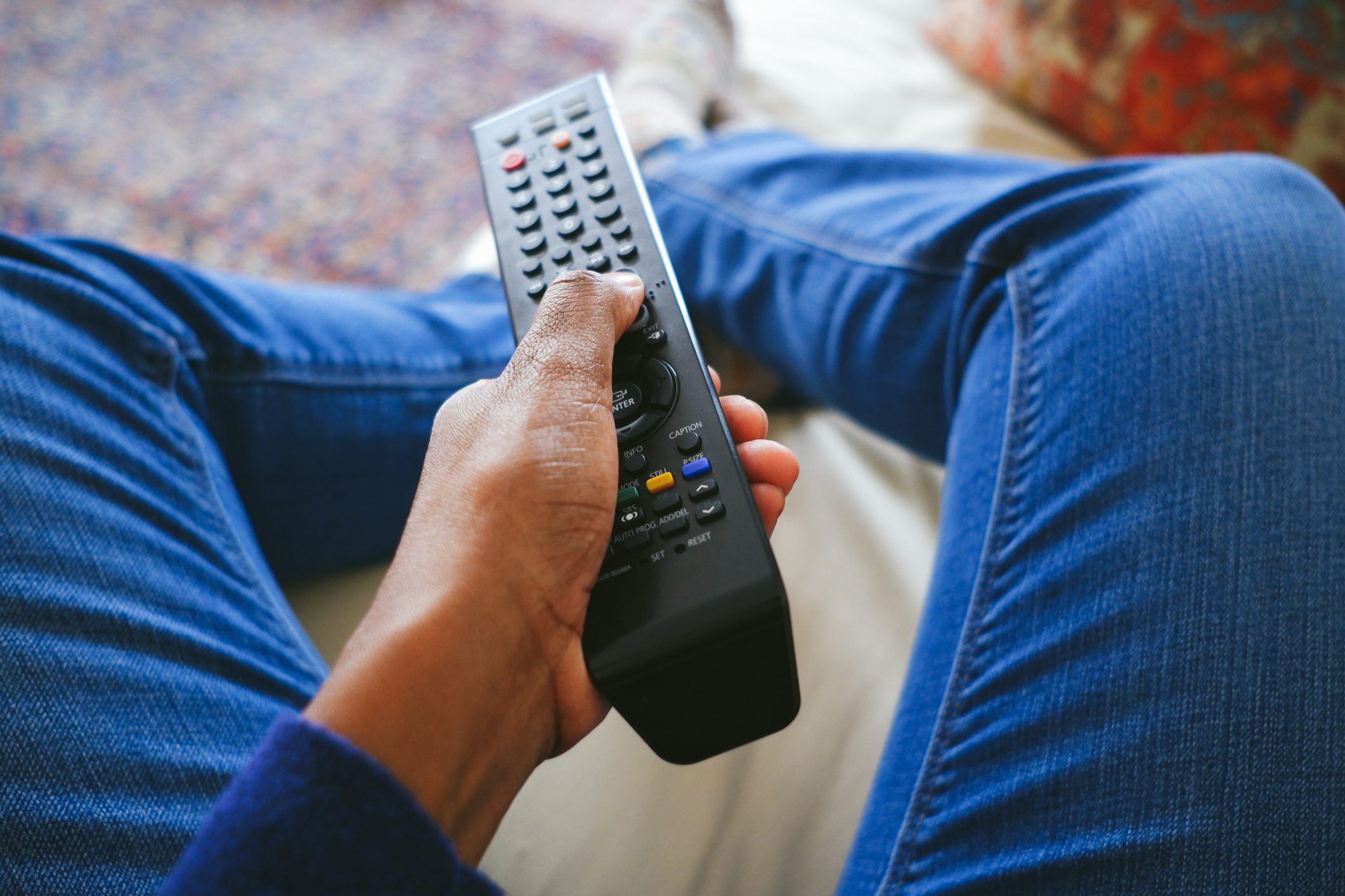 Woman Holds TV Remote Control