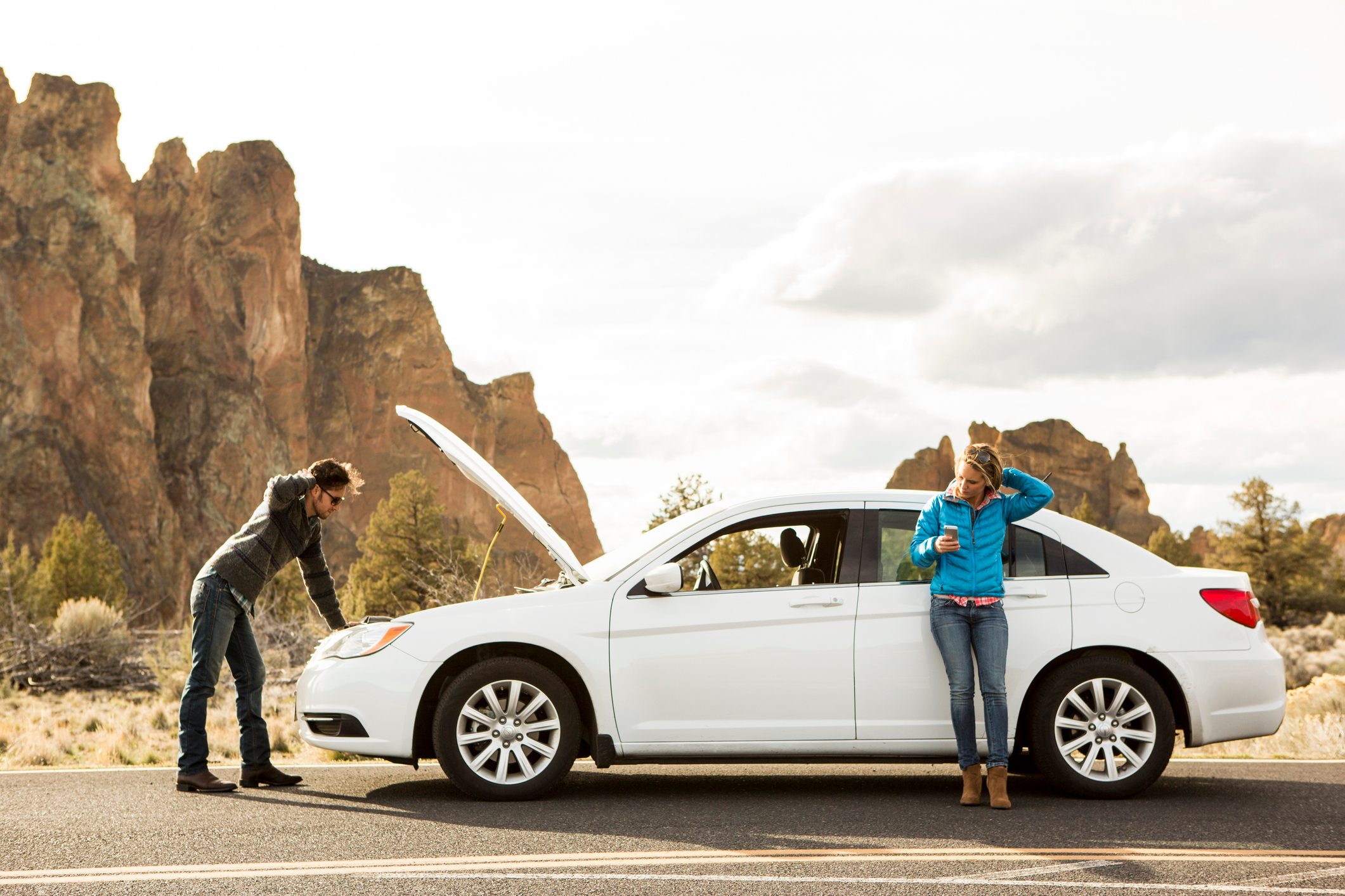 A couple with car trouble.