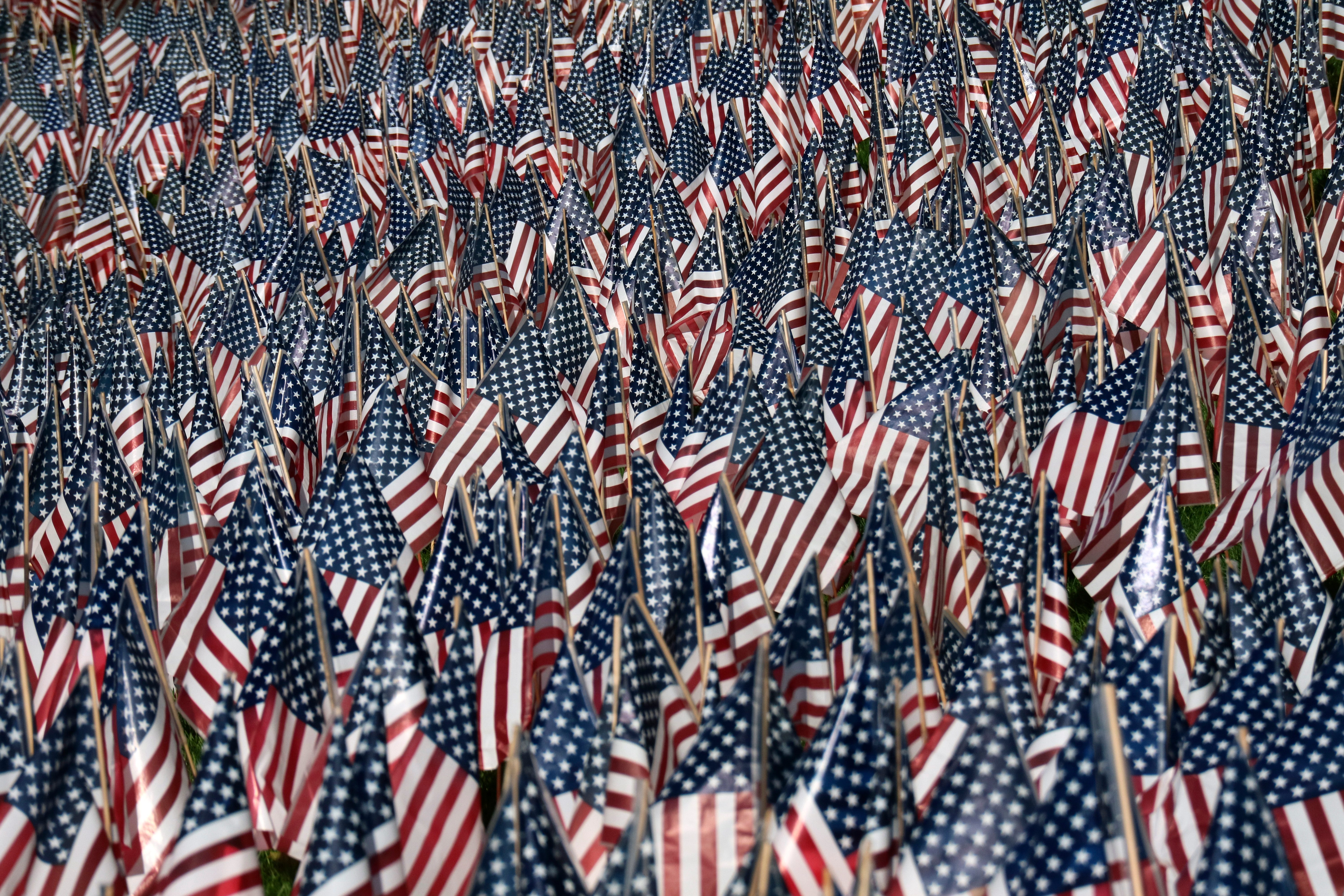 Thousands of US flags decorate the front lawn of the Fort Lee High School in advance of election day and Veterans Day on November 6, 2016 in Fort Lee, NJ.