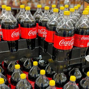 coca-cola bottles with yellow caps