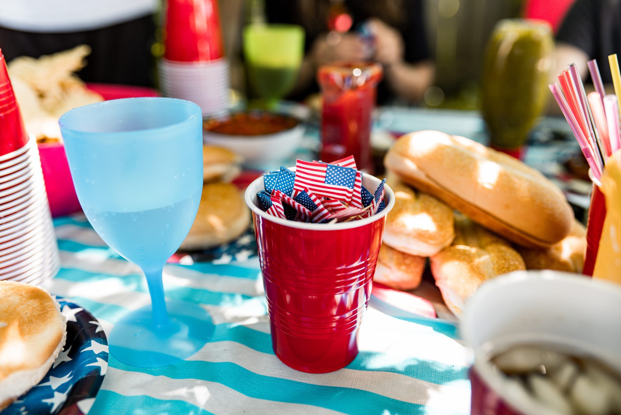 fourth of July barbecue table set up in a backyard