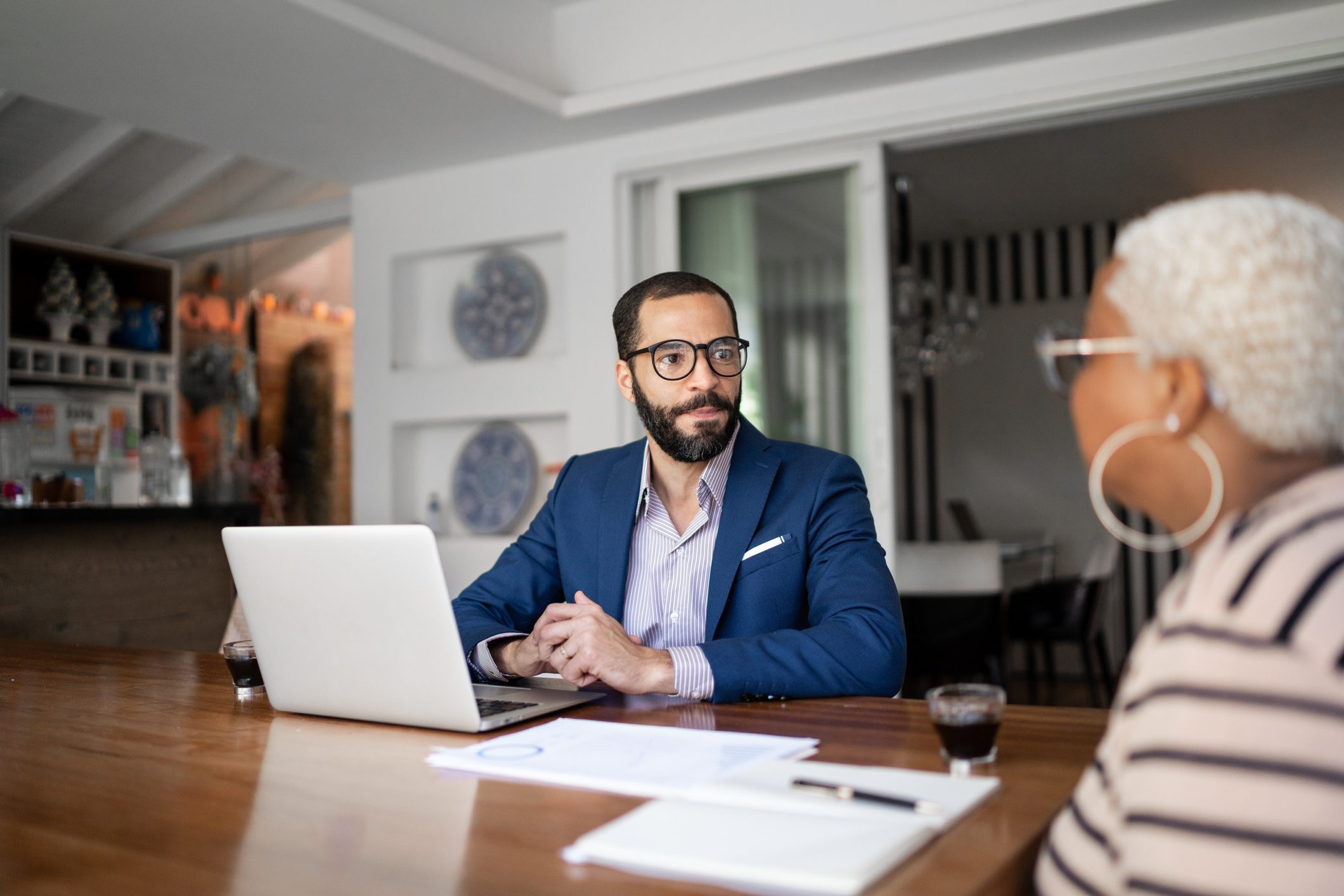 Woman talking to finance advisor at home