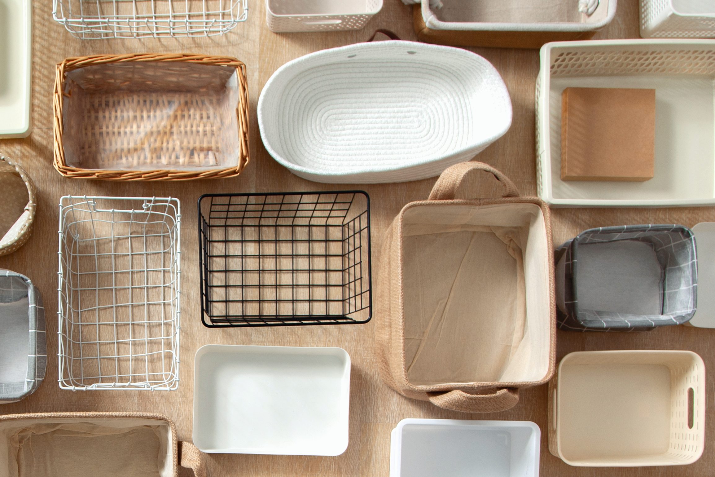 Flat lay of Marie Kondo's storage boxes, containers and baskets with different sizes and shapes