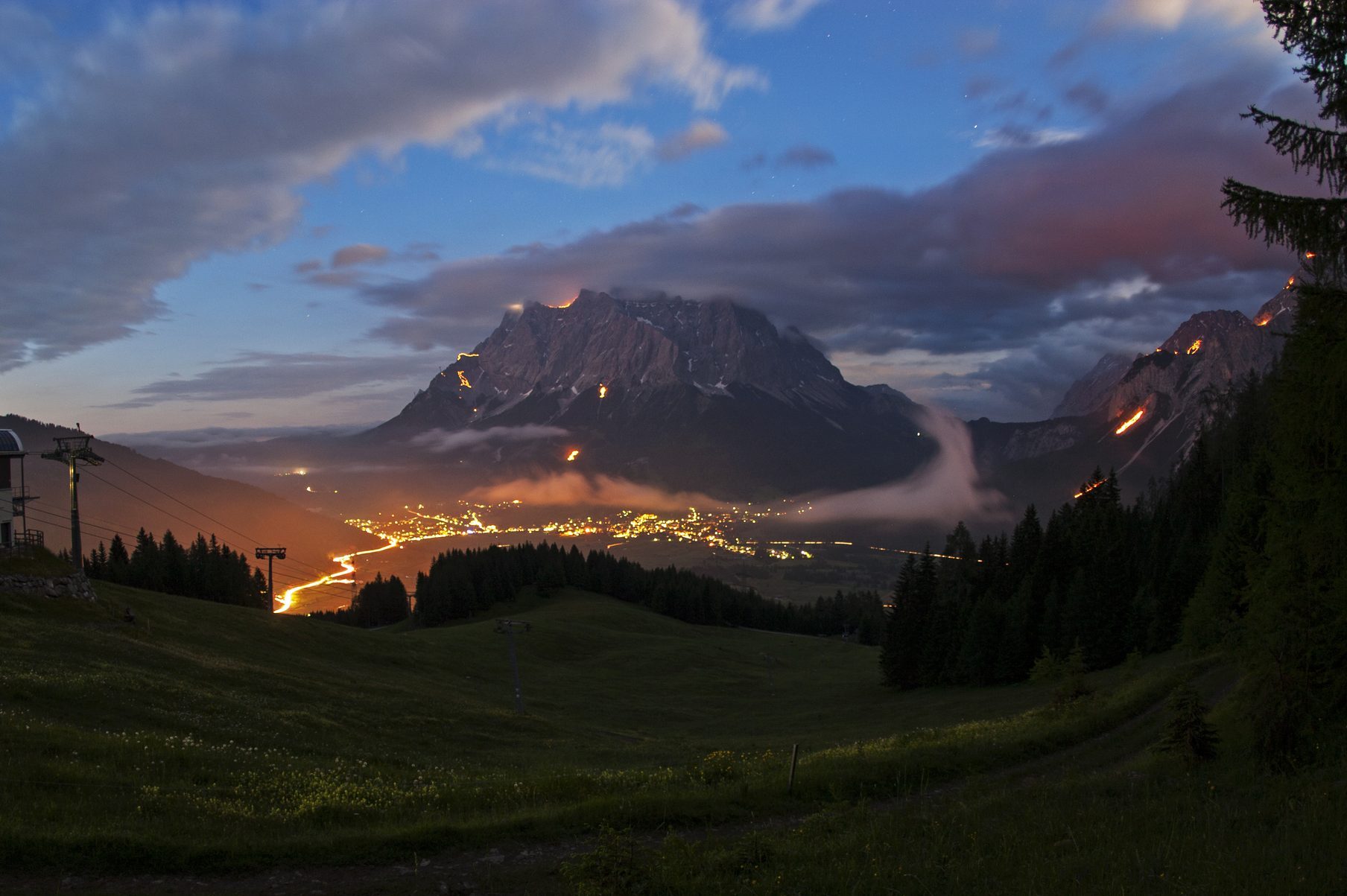 Mountain bonfires during solstice in Tyrol, Austri