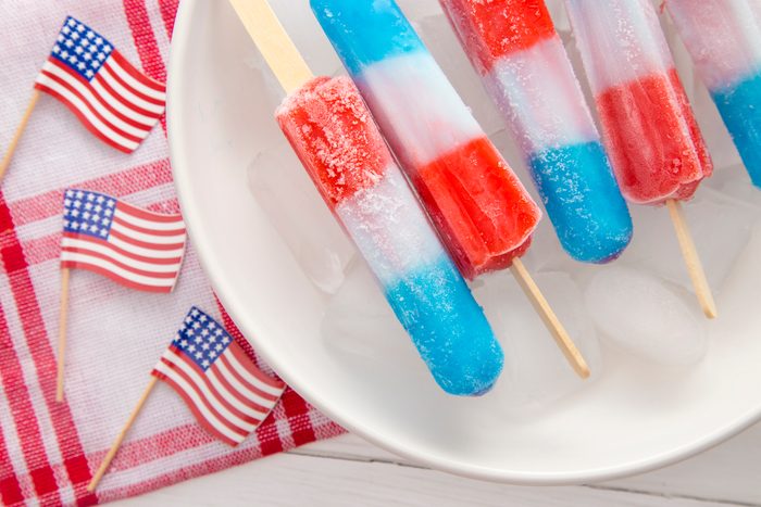 Red White and Blue Popsicles in a Bowl of Ice to Keep them Cool for Serving to your BBQ Guests