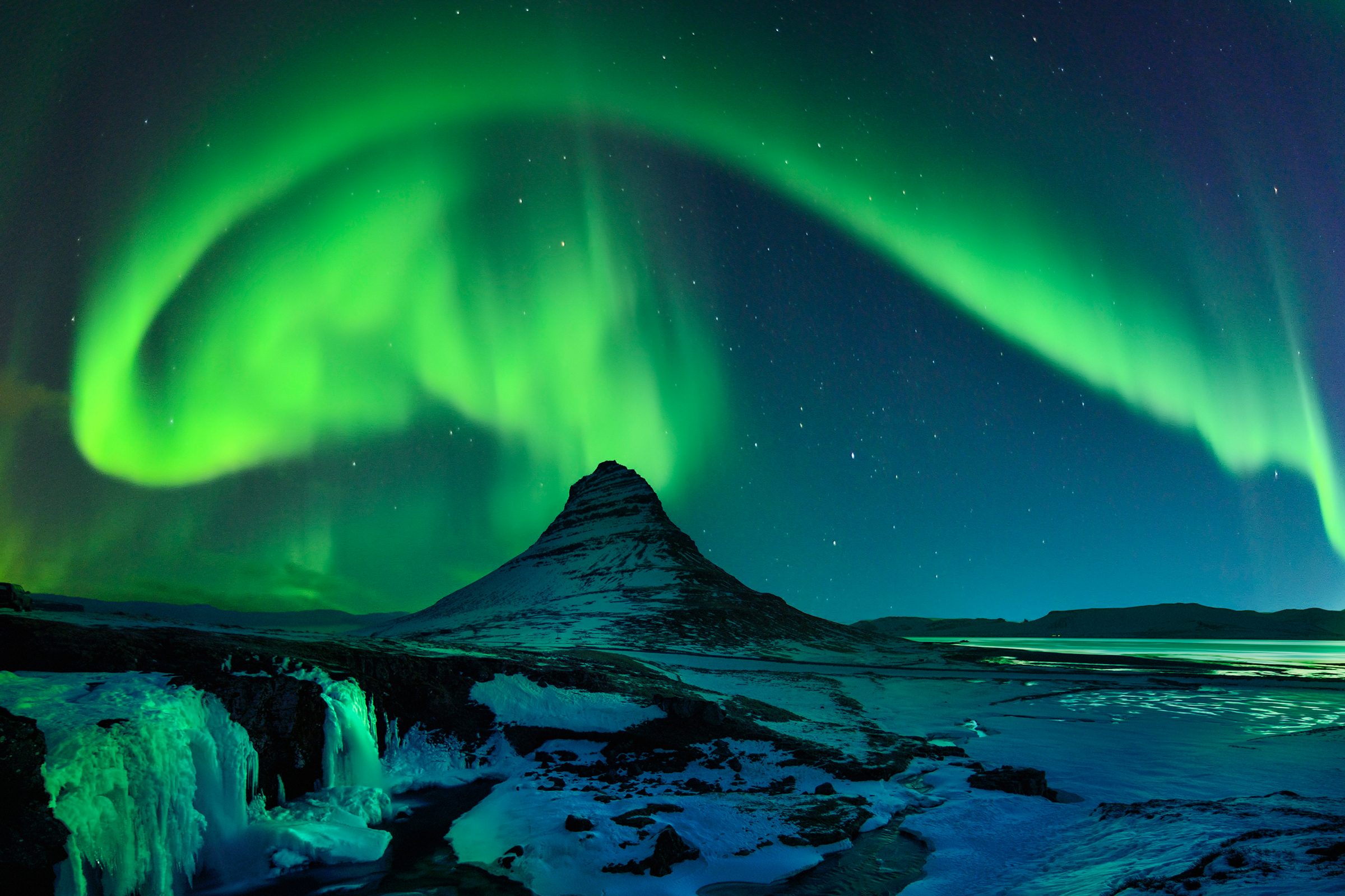 Freezing Kirkjufell and Aurora Storm Northern Lights, Iceland