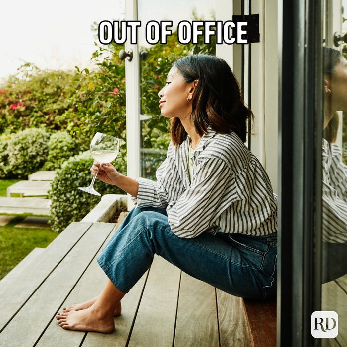 Gettyimages 1222811195 Smiling Woman Enjoying Glass Of Wine While Watching Sunset From Backyard