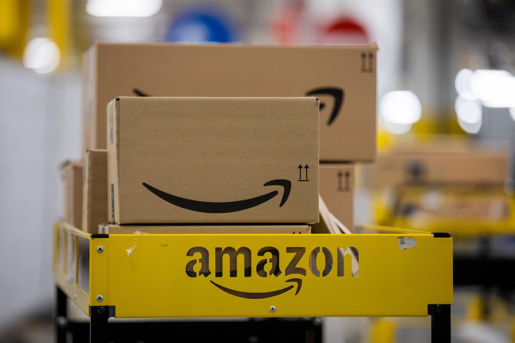 amazon boxes on a cart in an amazon warehouse