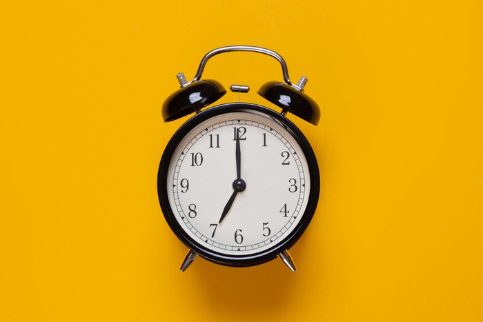 clock on yellow background