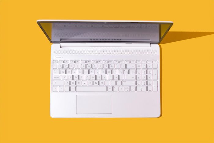 laptop on yellow background