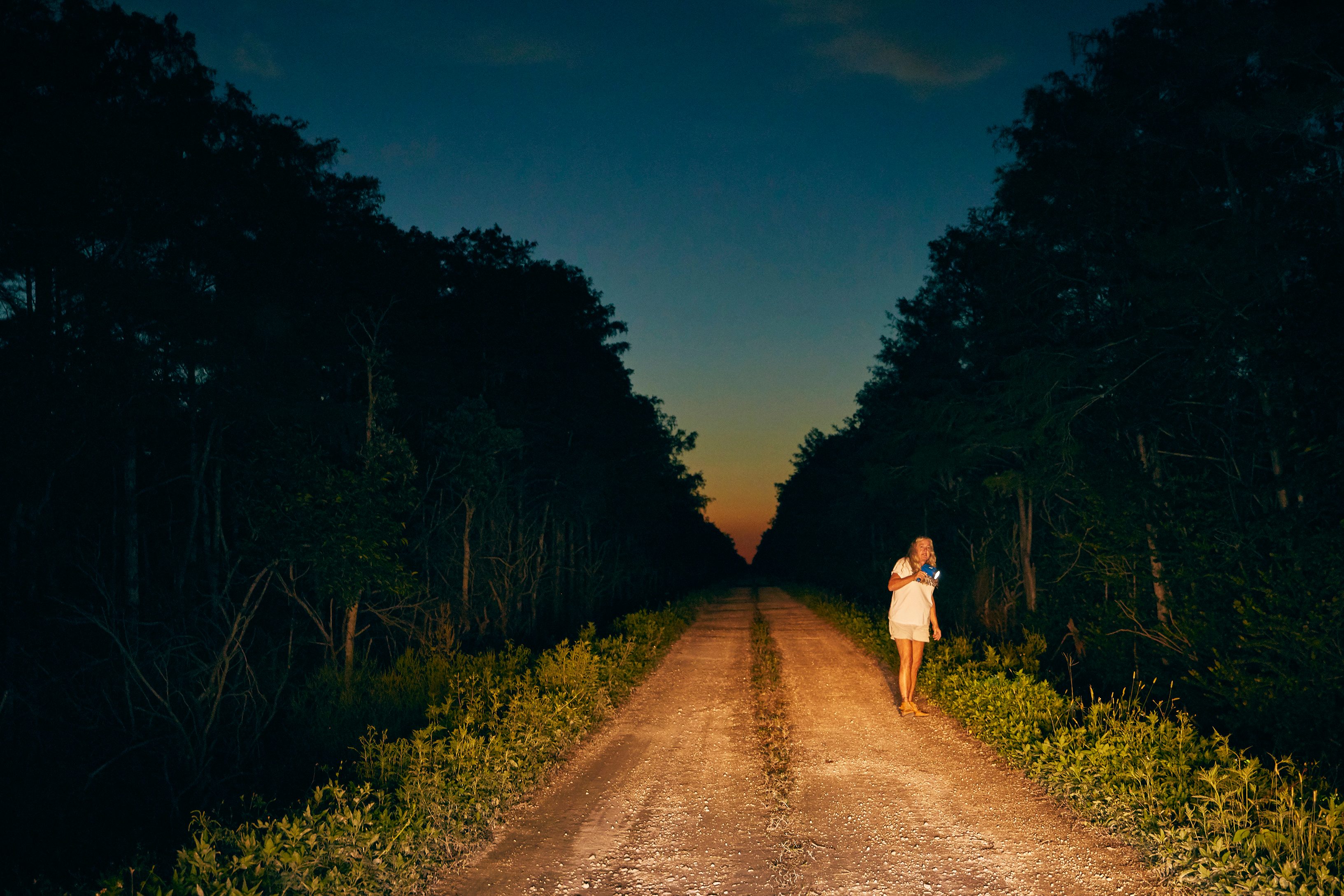 Anne Gorden-Vega scours the roads and levees at night for signs of scales.