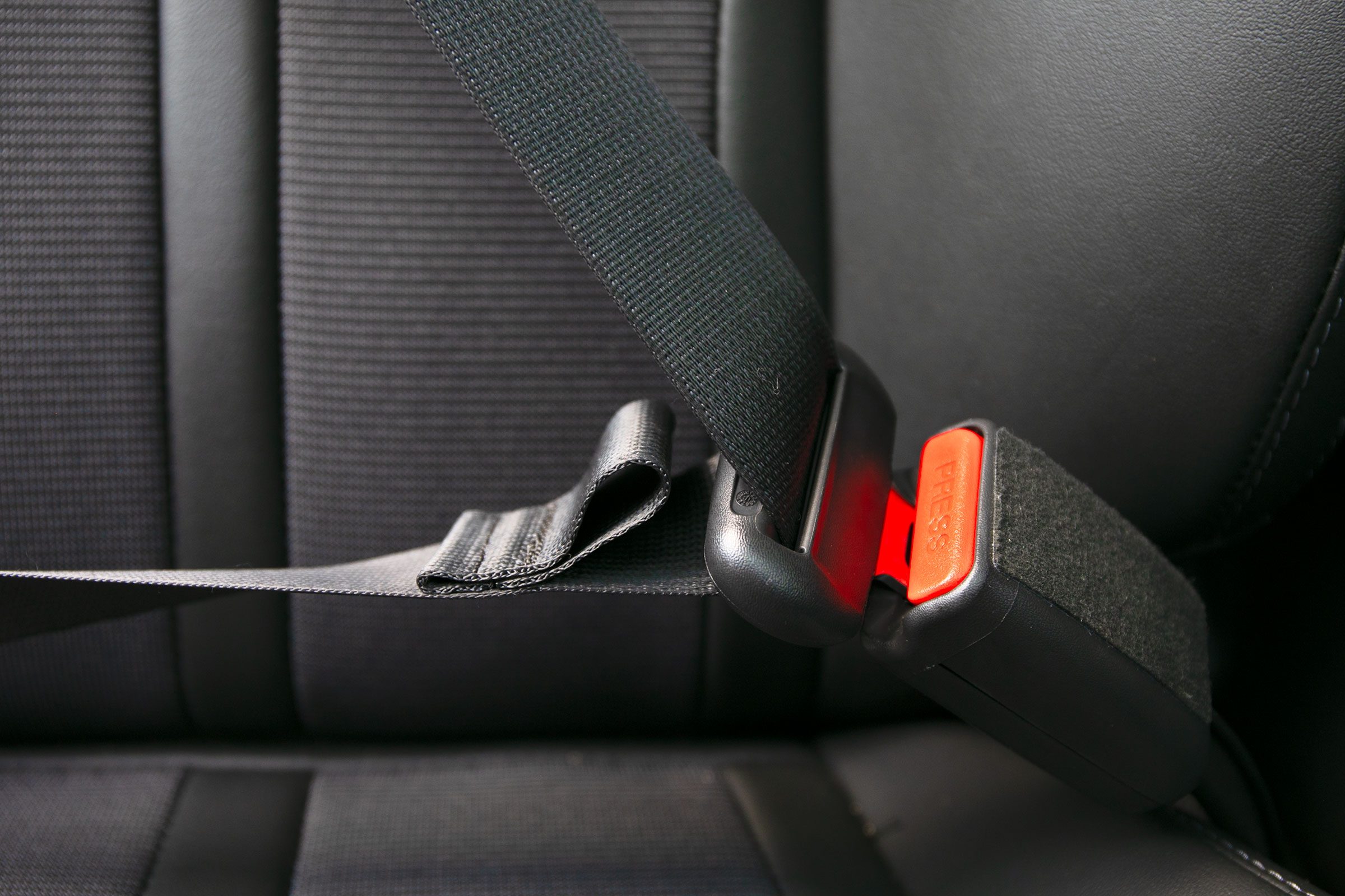 Why Your Seatbelt Has a Fabric Loop—and the Driver’s Seatbelt Doesn’t