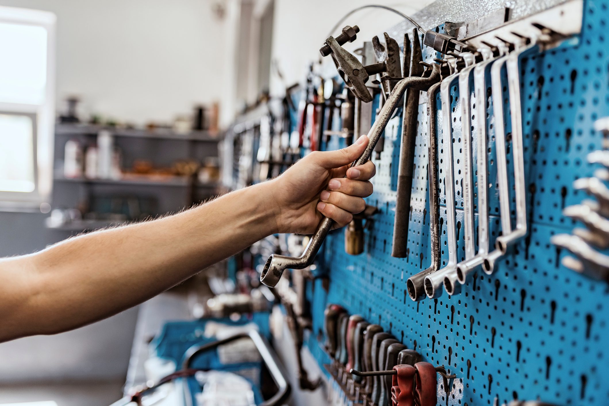 close up of hand grabbing tools