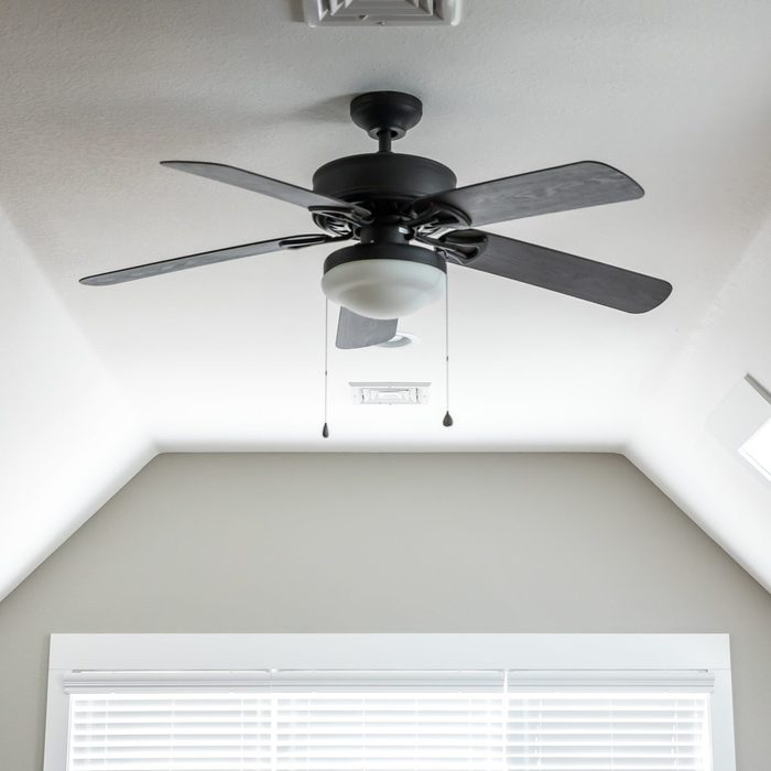 ceiling fan in bedroom of house