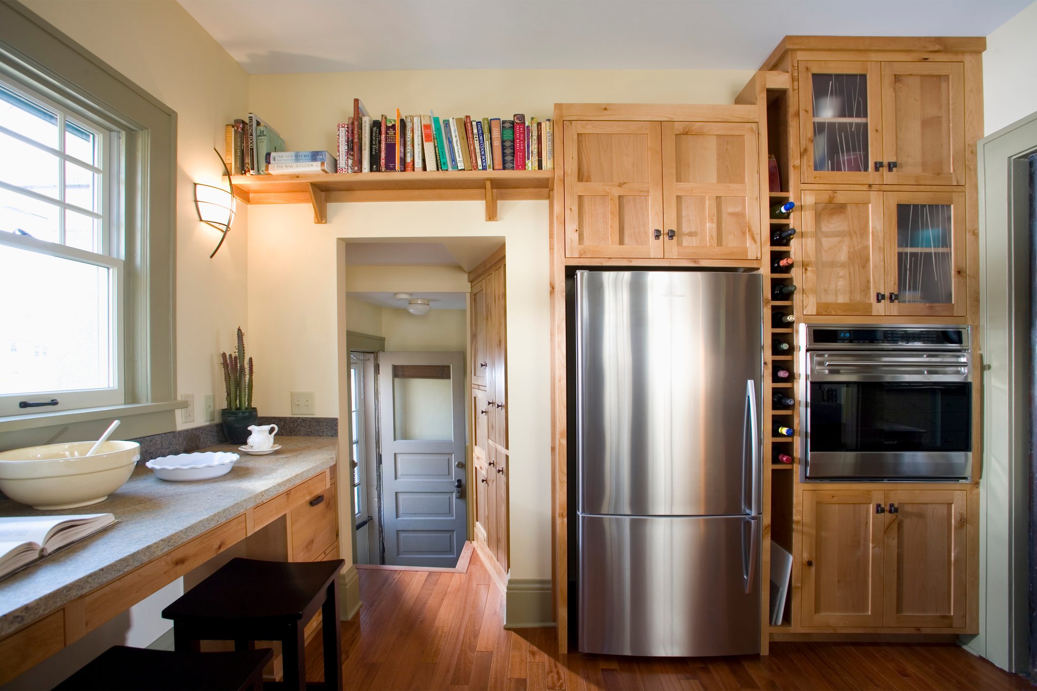 Back Door in Kitchen With Built-In Wood Cabinets