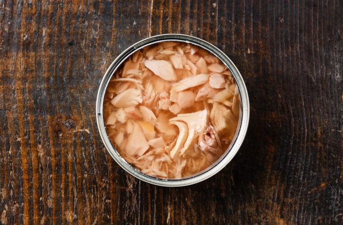Canned Tuna on wooden table